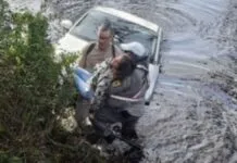 Na foto, o soldado da Brigada Militar no resgate da mulher