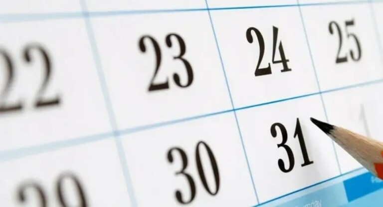 Imagem de calendário com lápis marcando data feriado