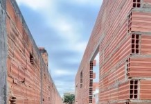 A lei brasileira que permite usar muro de vizinho